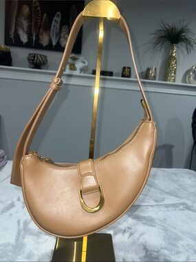 Madison West Saddle Shoulder Bag in a tan/brown